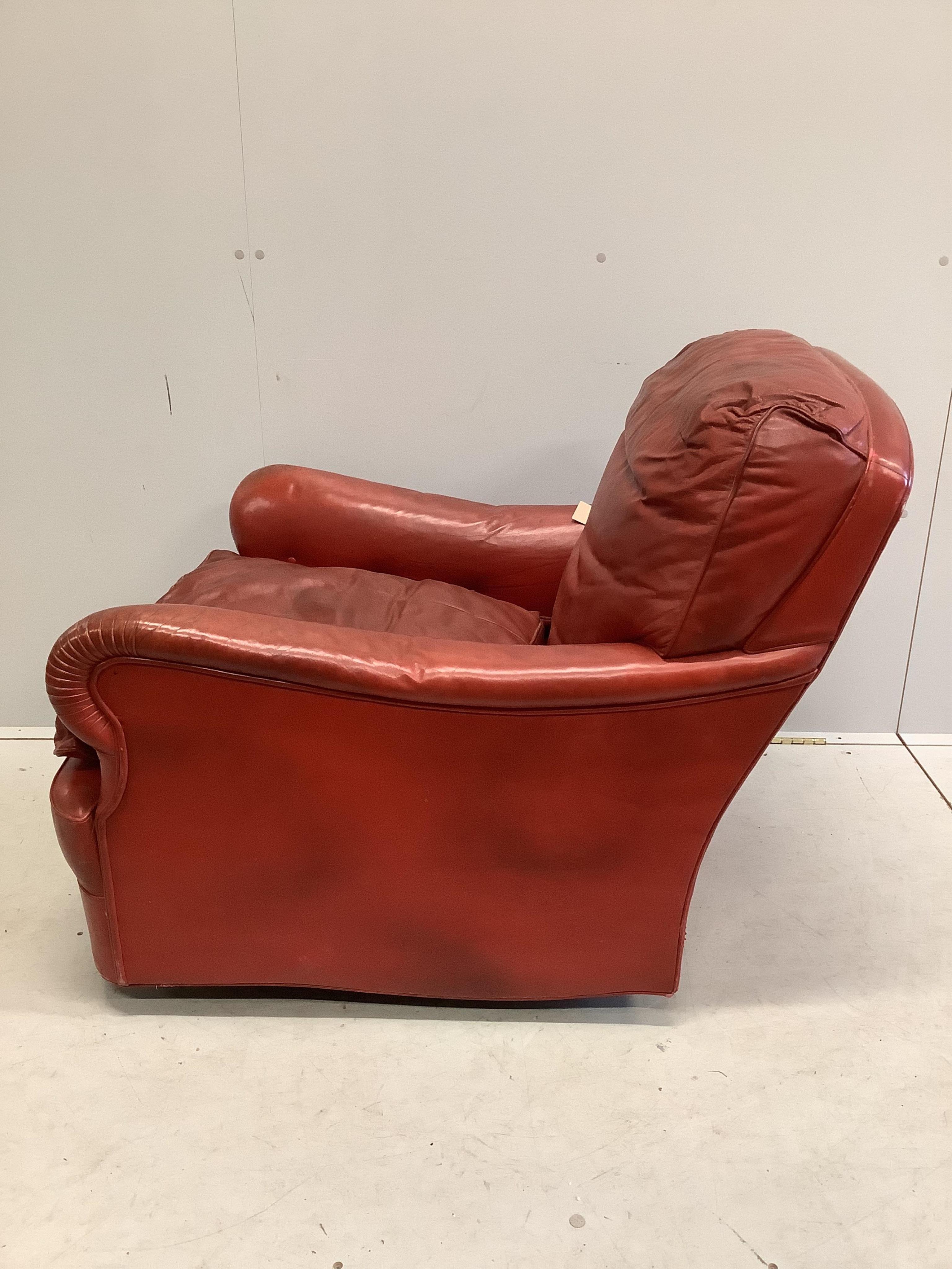 An Art Deco red leather club armchair, width 75cm, depth 90cm, height 80cm. Condition - poor to fair